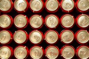 Coca-Cola cans tightly packed side by side